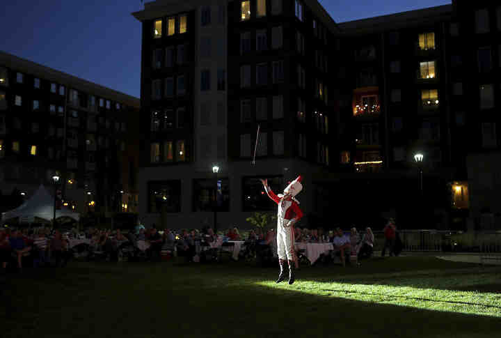 Drum Major Konner Barr catches his baton during The Ohio State University Marching Band performance with the Columbus Symphony Orchestra at the Picnic with the Pops at the Columbus Commons.  (Brooke LaValley / The Columbus Dispatch)